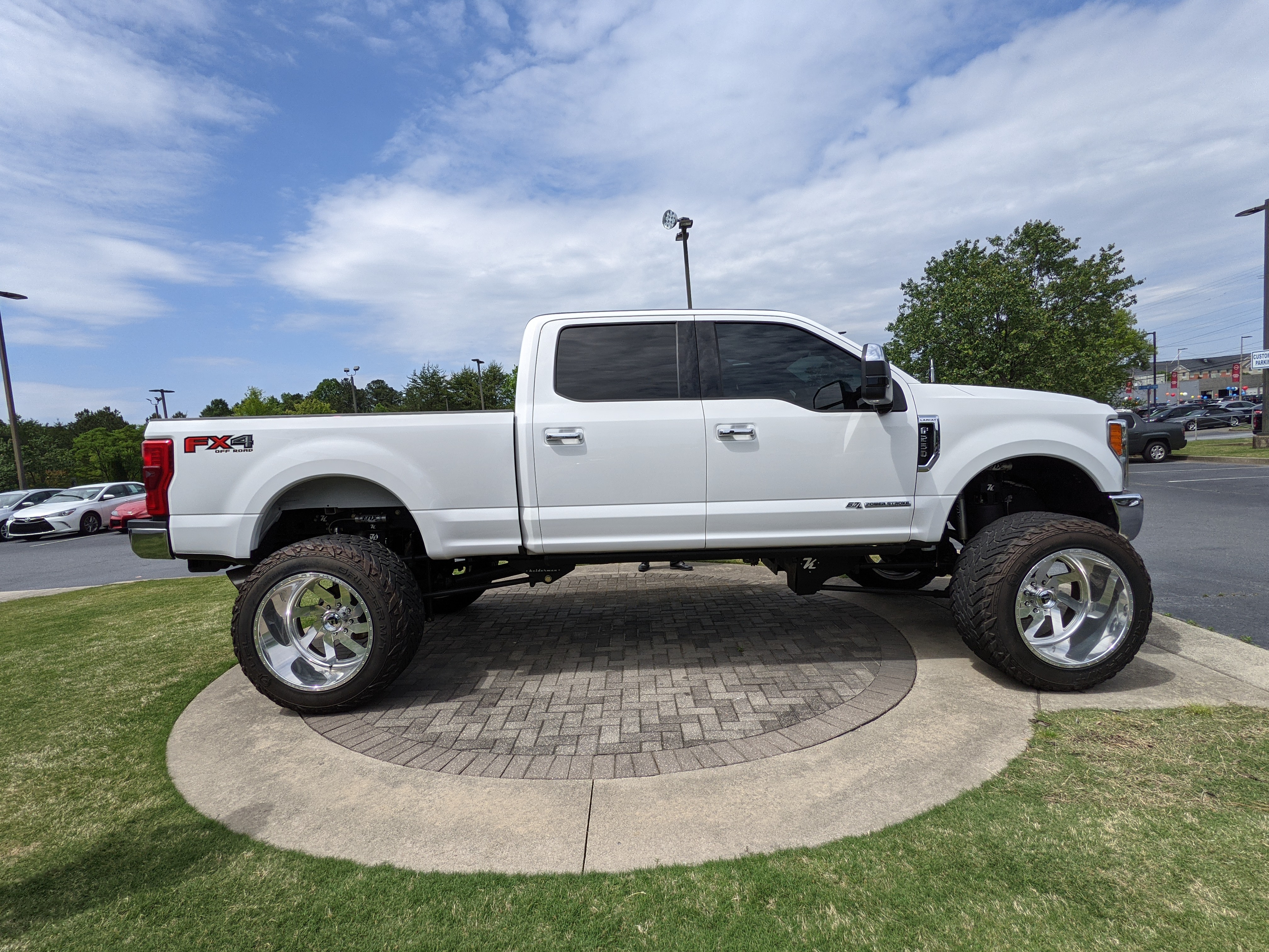 A crazily modded Ford truck at a dealership